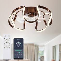 a remote control is shown next to a ceiling light with an appliance on it