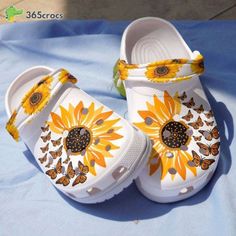 The Sunflower Butterfly White Hippie Flower Be Kind Positive Unisex Clogs Clog Shoes are not just your ordinary pair of shoes – they are a symbol of positivity, kindness, and style. Crafted with utmost care and attention to detail, these clog shoes are designed to make a statement while providing unparalleled comfort. Featuring a vibrant sunflower and butterfly design on a white background, these shoes exude a sense of joy and tranquility. The intricate flower patterns add a touch of elega Sunflower Shoes, Shoes Birthday Gift, Clogs Crocs, Sunflower Butterfly, Butterfly Shoes, Crocs Clog, Sunflower Gifts, Crocs Crocband, Crocs Clogs