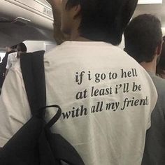 the back of a man wearing a t - shirt that says if i go to hell at least it'll be with all my friends