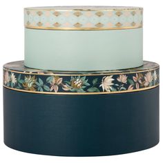 three stacks of blue and gold plates stacked on top of each other, one with floral designs