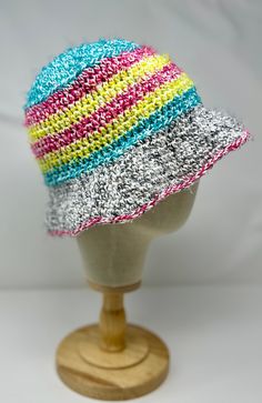 Spring/Summer Bucket Hat Handmade from 78% cotton and 22% polyester Hat is approx. 8.5" tall by 22" wide at head fit.  Hat will stretch a bit for wearing.  Super cute and fun for spring and summer!!   Cotton allows hat to breathe well and not be too hot!  Colors are bright and fun; Hot pink, neon yellow and bright teal with a grey,black white mix. Hat is a looser, floppy fit due to nature of this particular yarn.  Lightweight and airy. Machine wash cold. Lay flat and reshape to dry. Cotton Vacation Hat, Cotton Bucket Hat For The Beach, Cotton Crochet Hat For Vacation, Cotton Sun Hat Cap For Vacation, Cotton Brimmed Hat For Beach Season, Cotton Vacation Cap Sun Hat, Cotton Cap Sun Hat For Vacation, Cotton Brimmed Beach Hat, Cotton Beach Cap