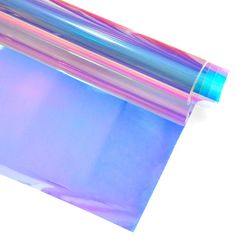 a roll of clear plastic wrapper sitting on top of a white surface with blue and pink stripes