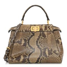 This is an authentic FENDI Snakeskin Camoscio Mini Peekaboo Iconic Satchel in Asfalto and Nocciola. This beautiful handbag tote is crafted of snakeskin leather. The bag features a sturdy, reinforced leather top handle with gold links with a gold turn lock that when opened, releases the central sturdy panel with sides relaxed and carried as a tote. With the lock secure, there is a cross-body shoulder strap to be worn as a shoulder bag. Peekaboo Top, Peekaboo Bag, Fendi Mini, Python Skin, Authentic Designer Handbags, Beautiful Handbags, Louis Vuitton Shoes, Bag Style, Pocket Bag