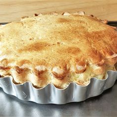 a pie sitting on top of a metal pan