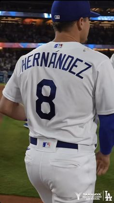 a baseball player is walking on the field