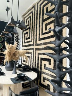 a dining room with black and white decor