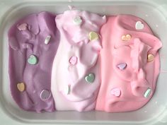 three different colored ice creams in a plastic container