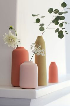 three vases with flowers in them sitting on a shelf next to each other and the caption reads, creative projects