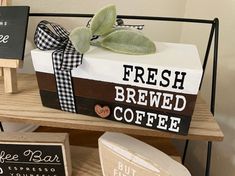 a sign that says fresh brewed coffee on it next to other signs and decorations