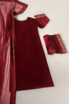 Meticulously crafted from a remarkably glamourous shade pomegranate maroon ( pure velvet 60 gms ) “ Maroon Velvet “ with its intricate hand crafted details strikes the perfect balance between elegant and eye-catching, making this beautiful design a must have. The length of the long kameez is 48 inches.Agha Noor’s style Eid Outfits Pakistani, Maroon Velvet Dress, Long Kameez, Eid Fashion, Agha Noor, Desi Dress, Simple Lehenga, Velvet Dress Designs, Fancy Suit