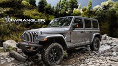 a gray jeep is parked on some rocks and trees in the background with an i - wrangler logo above it