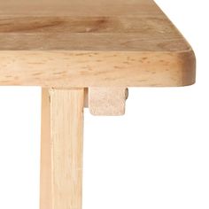 a close up of a wooden table with one piece missing from the top and another piece missing from the bottom