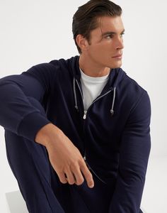 Techno cotton French terry hooded sweatshirt with zipper The excellence of Brunello Cucinelli materials enriches the Travelwear line, dedicated to moments of relaxation and free time. This lightweight and soft techno cotton French terry sweatshirt features a drawstring hood, a two-way zipper closure and large front pockets. Navy Athleisure Hoodie With Double-lined Hood, Navy Double-lined Hood Hoodie For Athleisure, Navy Hoodie With Drawstring For Loungewear, Navy Drawstring Hood Loungewear Hoodie, Navy Hooded Hoodie For Loungewear, Sweatshirt With Zipper, Rib Knitting, Suit Shoes, Knit Sleeve