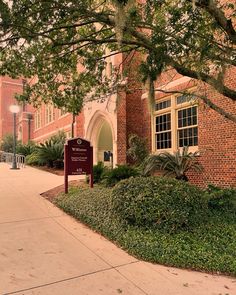 a brick building with a sign in front of it that says the university of southern florida