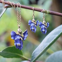 Our beautiful Iris flower necklace and earrings set is a beautiful way to add a splash of colour and elegance to your outfit. Both earrings and necklace are hand finished in blue enamel. This beautiful flower jewellery embodies nature with its intricate realistic design and attention to detail. Designed by us, in our London office. The Iris is a symbol of hope, wisdom, trust and valor. Irises make fabulous gifts for nature lovers, they are the birth flower for the month of February, the gift to Blue Sterling Silver Jewelry With Birth Flower, Blue Sterling Silver Birth Flower Jewelry, Blue Flower-shaped Jewelry With Flower Charm, Elegant Blue Jewelry With Birth Flower, Blue Flower Charm Jewelry As Gift For Her, Blue Flower-shaped Jewelry For Her, Elegant Blue Flower Pendant Necklace, Elegant Blue Birth Flower Earrings, Elegant Enamel Jewelry As Gift For Her