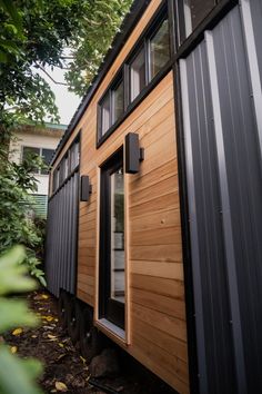 the tiny house is made out of wood and metal