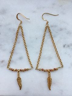 Beautiful Gold Plated Leaf Earrings. Adjustable Nickel-free Earrings For Festive Occasions, Nickel-free Dangle Earrings For Festive Occasions, Gold Metal Beaded Earrings For Festivals, Gold Beaded Earrings For Pierced Ears, Bohemian Gold Linear Earrings With Ear Wire, Gold Teardrop Chandelier Earrings For Festivals, Adjustable Latkans Drop Earrings, Gold Dangle Earrings For Festivals, Gold Dangle Crystal Earrings For Festival