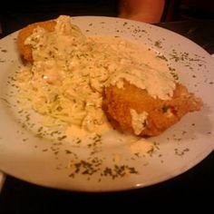 a white plate topped with food on top of a table