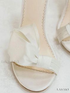 Lasaky - Satin White Bridal Sandals: Elegant Open Toe Design with Bow Embellishment, Ankle Strap, and Block Heel - Perfect for Parties and Weddings Elegant Open Toe Sandals For Bridal Shower, Elegant White Wedding Sandals, White Round Toe Sandals For Wedding, White Round Toe Wedding Sandals, White Low Heel Sandals For Wedding, Elegant Low Heel Sandals For Wedding, Cream Closed Toe Sandals For Wedding, Elegant Open Toe Sandals For Ceremony, Elegant Ankle Strap Sandals For Bridal Shower