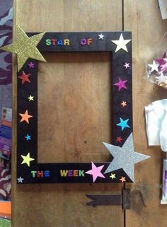 a wooden frame decorated with stars and the words star of the week