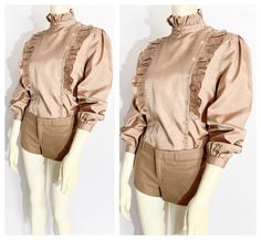 Vintage Ruffle Front Long Sleeve Tan Blouse / size Small-Medium ... *fabric unknown/unmarked. *sandy tan silk or silk-like fabric with slight sheen *high-collared, asymmetrical button front blouse with ruffle-front design *long sleeves with gathered-puff shoulders and gathered, buttoned sleeve cuffs *ruffled collar, cuff and bodice  *very, 1980s new-romantic, Princess Di Sloane Ranger meets 2024 Twee + Coquette mash-up.  *great vintage condition  LABEL : Good Year FABRIC : fabric unknown.  FIT: Sloane Ranger, Romantic Princess, Tan Silk, Tan Blouse, Womens Blouses, Good Year, Ruffled Collar, Small Dress, Dress Form