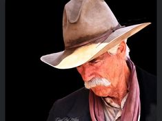 an old man wearing a hat and scarf