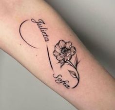 a woman's arm with a flower and the word peace written in cursive writing