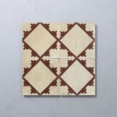 a white and brown tile with squares on it