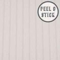 a sticker that says peel and stick on the side of a building with white siding