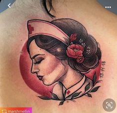 a woman with a flower in her hair is depicted on the back of this tattoo