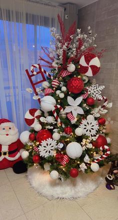 a christmas tree decorated with red and white ornaments