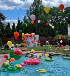 an inflatable pool filled with lots of balloons