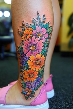 a woman's leg with flowers on it