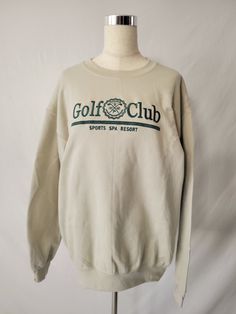 Stay stylish on and off the green with our embroidered "Golf Club" sweatshirt. Made with a soft cotton-polyester blend, this oversized sweatshirt features a crew neckline and long sleeves for ultimate comfort. The bold embroidered design adds a touch of elegance and uniqueness to your wardrobe. Perfect for any golf enthusiast, this sweatshirt will keep you cozy and fashionable in any season. Fit: Relaxed Unisex 50% COTTON 50% POLYESTER Cotton Long Sleeve Golf Sweatshirt, Casual Golf Sweatshirt With Crew Neck, Sporty Crew Neck Golf Sweatshirt, Sporty Crew Neck Sweatshirt For Golf, Club Sweatshirts, Golf Sport, Oversized Sweatshirt, Embroidered Design, Golf Club