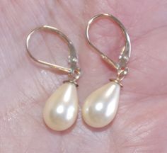 Old stock vintage 14k 35 mm golden teardrop majorca pearl leverback earrings welcome to my handmade store: hand made 14k solid gold 35 mm white / golden perfect tear drop white / golden majorca pearl leverback earrings these earrings are hobe old stock pearls from spain. they are from hobe comoany. some have discolorations but i cleaned them. some might have some not vidsible scraches or minor cracks on top drills on the upper coating part which might not be seen on drill part which is coverd by Classic Teardrop Clip-on Pearl Earrings, Cream Pearl Drop Earrings For Formal Occasions, Formal Cream Pearl Earrings, Formal Teardrop Clip-on Pearl Earrings, Vintage Teardrop Pearl Earrings For Anniversary, Teardrop Pearl Earrings With Lever Back For Anniversary, Teardrop Pearl Earrings For Anniversary With Lever Back, Teardrop Pearl Earrings With Lever Back For Wedding, Pearl Teardrop Earrings