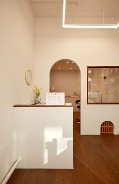 the interior of a home with wood floors and white walls