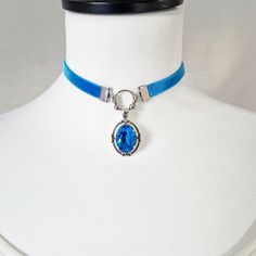 Choker necklace, Victorian style velvet choker with a mermaid blue crystal cabochon. -------------- Details ---------------- - Real oval faceted cut crystal: 13x18mm - Crystal color: capri blue (intense and vibrant color) - Victorian medieval medallion pendant in antique silver metal: 42x22mm - Choker in matching blue velvet and stainless steel findings: 32-39cm with the extension to adjust to your convenience (contact me for another length) - Several colors available (contact me for customizati Victorian Mermaid, Ocean Gifts, Mermaid Pendant, Velvet Choker, Crystal Blue, Small Mirrors, Capri Blue, Victorian Style, Blue Crystals