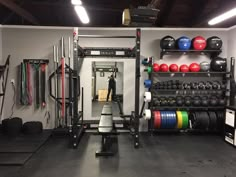 a man is standing in the doorway of a gym with several exercise equipment on shelves