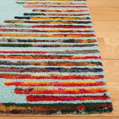 a multicolored area rug on the floor