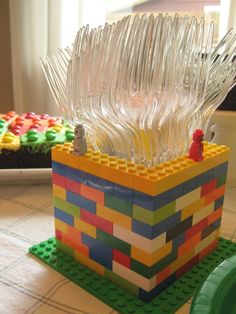 an image of a lego box with plastic forks sticking out of it's sides