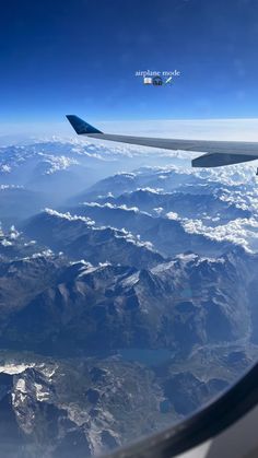 the view from an airplane looking down on mountains