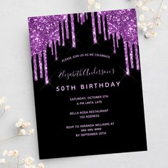 purple and black birthday party card with glitter drips on the bottom, in front of white flowers