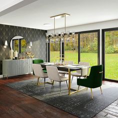 a dining room with green chairs and a white table in front of a large window