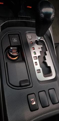 an automatic gear box in a car with buttons and knobs