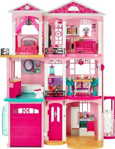 a pink doll house with lots of furniture