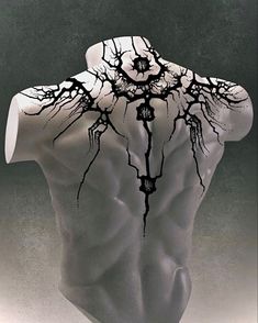 the back of a man's torso is covered in black and white art work