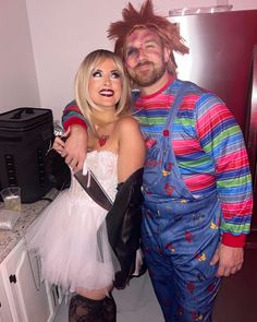 a man and woman dressed up in costumes