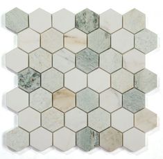 the white and grey hexagonal tile is arranged in an irregular pattern, with different colors