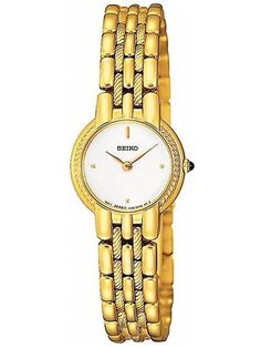 We are Seiko Authorized Dealer. We offer 100 % Authentic Watches,Original box,Manual,certificate of Authenticity card. Seiko SUJB32 women’s watch features a 20mm wide and 6mm thick yellow gold tone solid stainless steel case with a fixed bezel and textured push-pull crown. Seiko SUJB32 is powered by Japanese Quartz movement. This beautiful watch also features white dial with yellow gold tone luminous hands and dot hour markers, scratch resistant hardlex crystal and water resistant to 30 meters. Seiko SUJB32 is equipped with a 9mm wide yellow gold plated stainless steel bracelet with a deployment push button clasp. Seiko SUJB32 women’s white dial yellow gold tone steel bracelet watch is brand new and comes in an original Seiko gift box.  SEIKO WHITE DIAL YELLOW GOLD STEEL BRACELET WOMEN’S W Authentic Watches, Bracelet Women, Dress Watch, Beautiful Watches, Ladies Watch, White Dial, Bracelet Gold, Push Button, Steel Bracelet