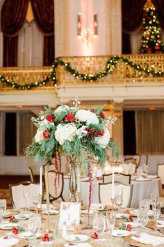 the centerpieces are decorated with flowers and greenery